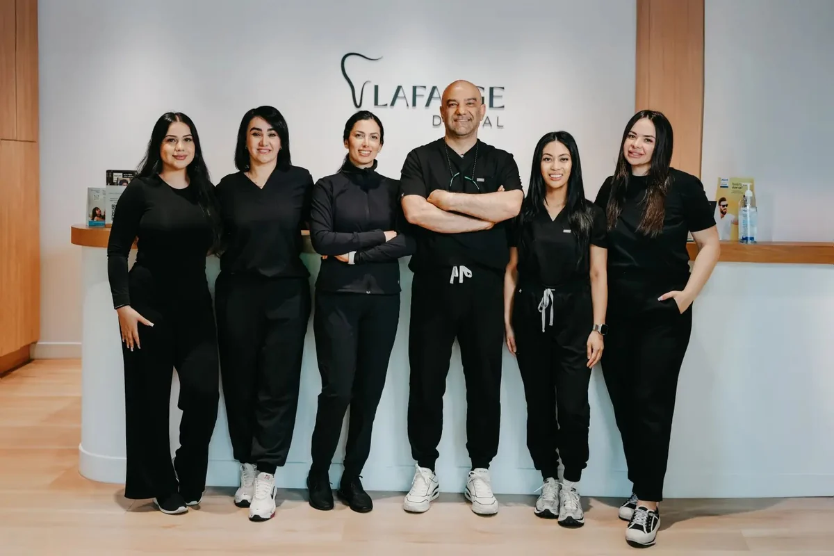 The Lafarge Dental team at the reception desk of the clinic in Coquitlam, BC